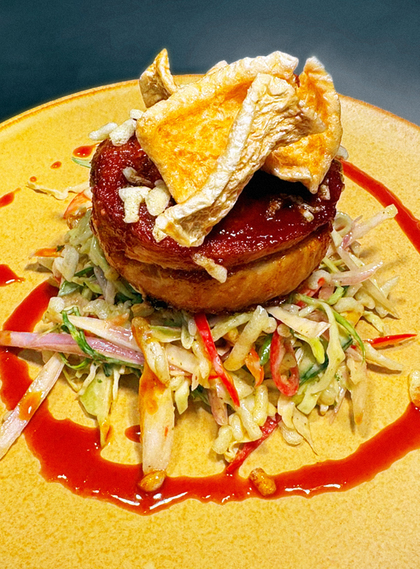 Slow cooked pork belly with Parmesan polenta, braised hispi cabbage and a Dijon mustard sauce.
